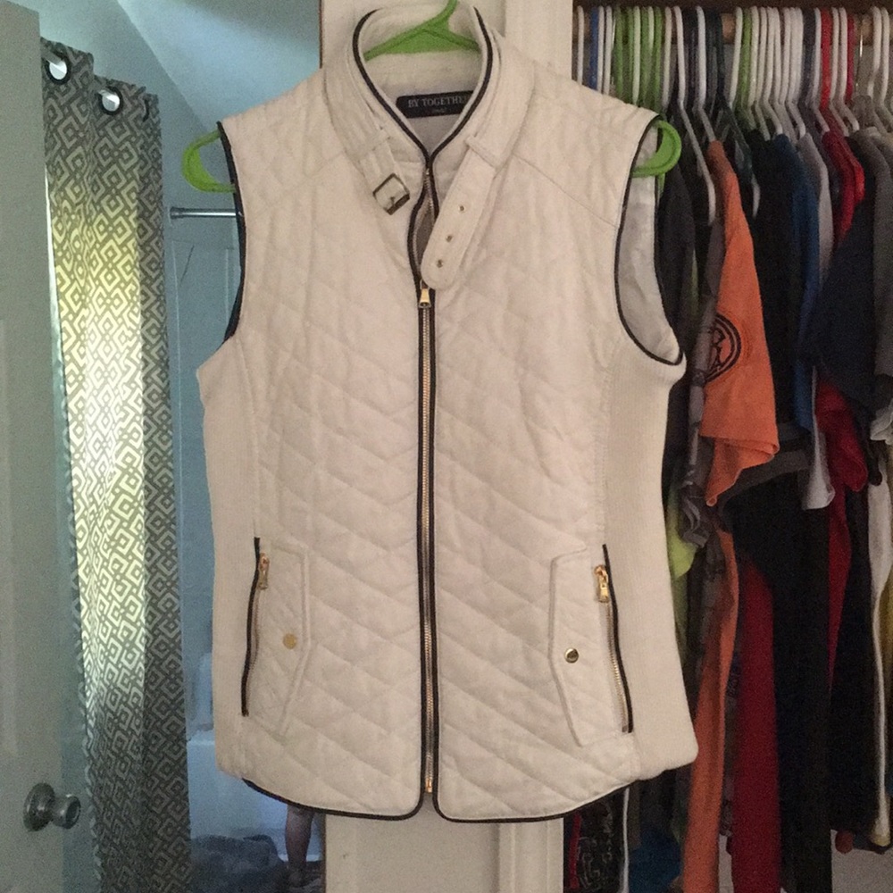A white leather zip up vest